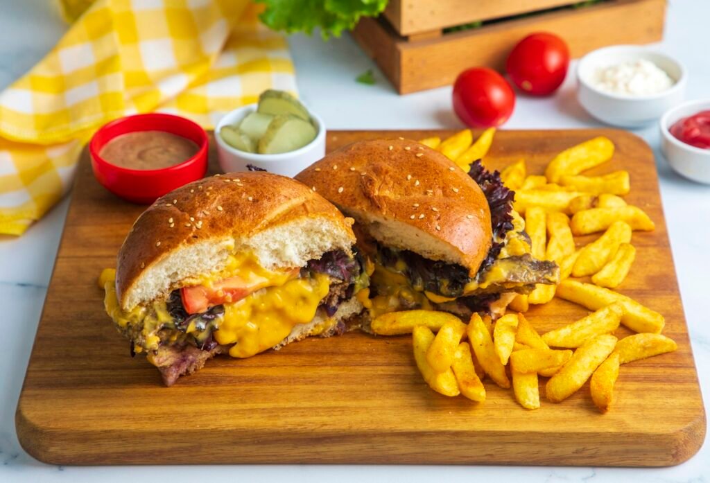 Homemade hamburger served with french fries.