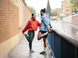 Runners Stretching After Workout